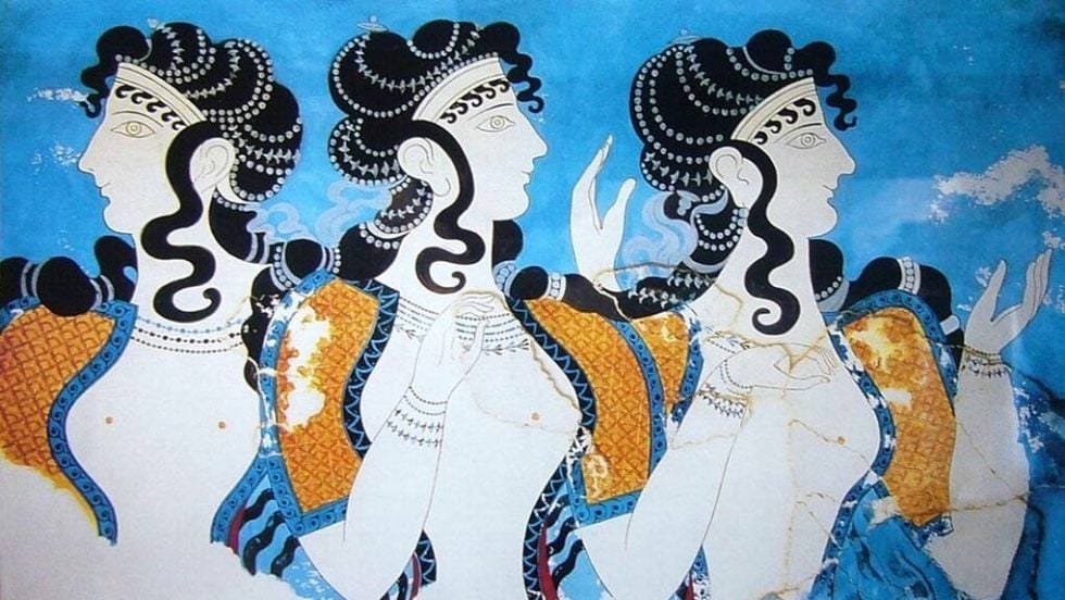 Όμορφες Μινωίτισσες που κουβεντιάζουν. Έχουν ωραία φορέματα, σύμφωνα με τη μόδα της εποχής, όμορφα χτενισμένα μαλλιά και πολύτιμα κοσμήματα