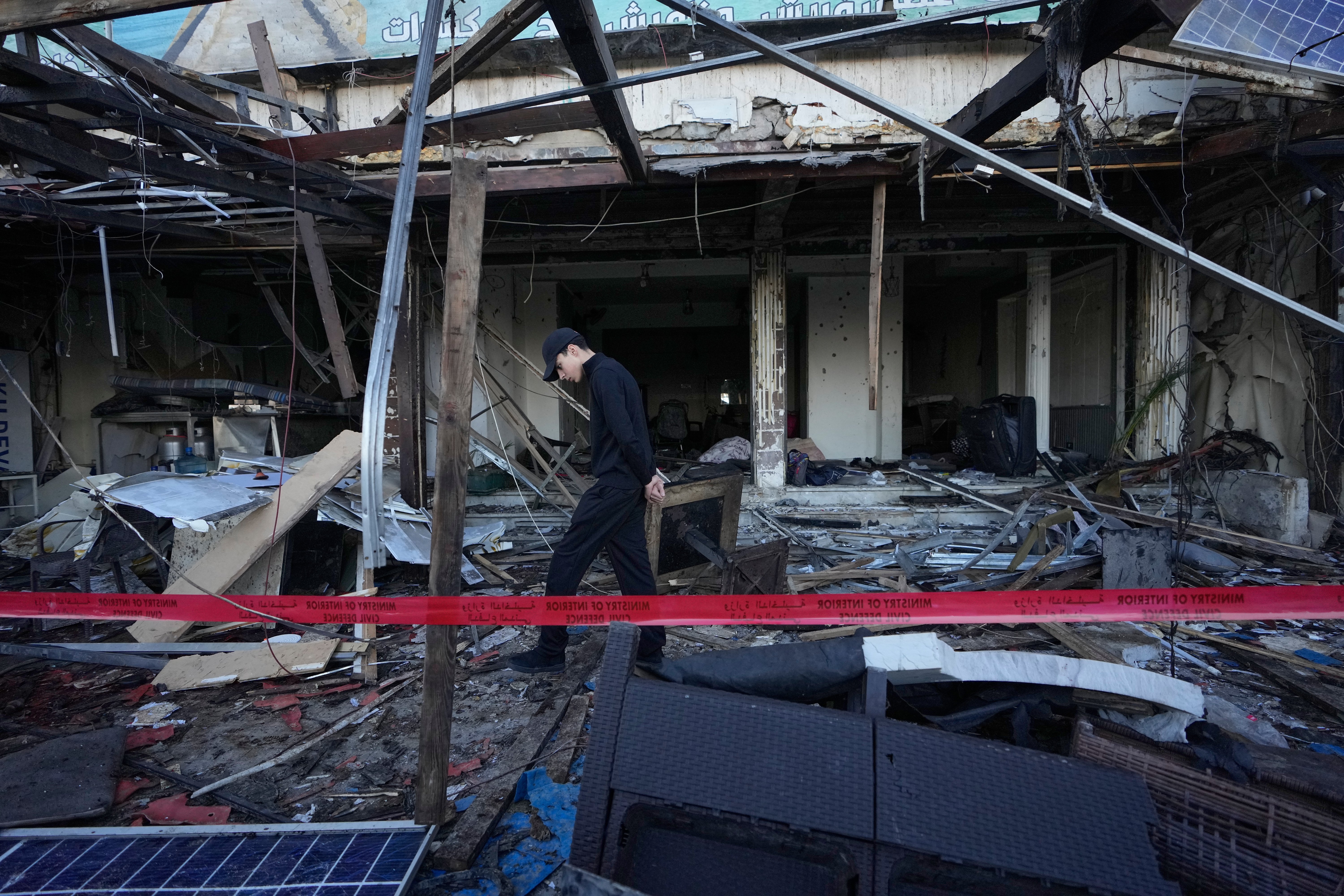 A man checks a destroyed coffeeshop at the site of an Israeli strike in the southern port city of Sidon, Lebanon, Wednesday, April, 8, 2026. | AP Photo/Mohammed Zaatari